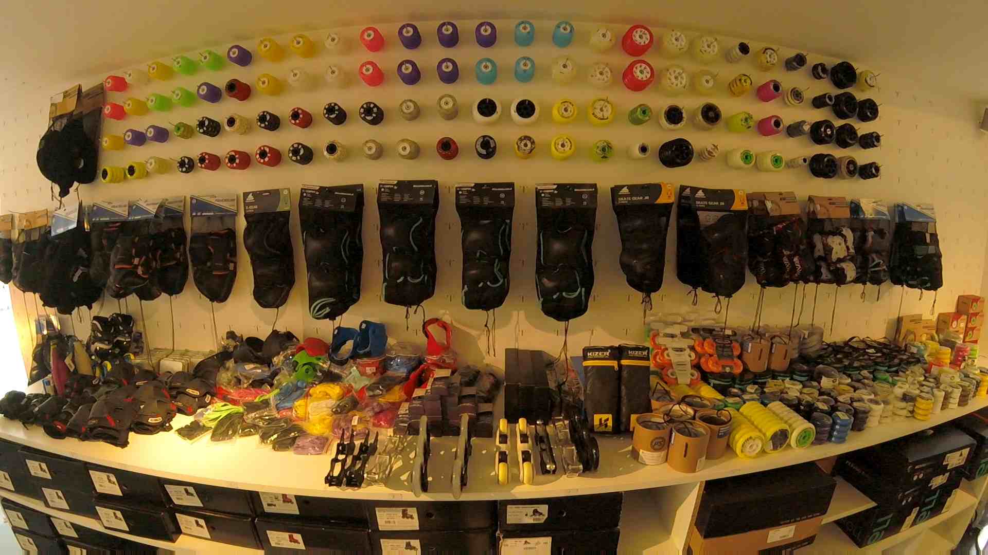 The wall of the store Sliding Tiger, at which there are a lot of inline skate wheels.